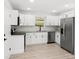 Well-lit kitchen featuring white cabinets, granite countertops, and stainless-steel appliances at 902 Grace St, Kings Mountain, NC 28086