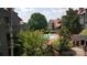 Inviting community pool surrounded by lush greenery and well-maintained landscaping, perfect for relaxation at 9035 Jm Keynes Dr # 39, Charlotte, NC 28262