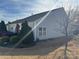 Backyard view showing a well-maintained lawn and landscaping around the property at 905 Roxburgh Ave, Rock Hill, SC 29732