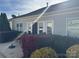 Features a cozy backyard patio with outdoor seating surrounded by vibrant landscaping at 905 Roxburgh Ave, Rock Hill, SC 29732
