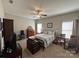 Cozy bedroom with ceiling fan, neutral paint, carpet and charming vintage furnishings at 905 Roxburgh Ave, Rock Hill, SC 29732