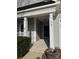 Welcoming front porch with classic design elements and lush green landscaping at 905 Roxburgh Ave, Rock Hill, SC 29732