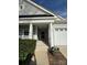 Inviting front porch with decorative pillars, flowering pot and clear view of the home's street number at 905 Roxburgh Ave, Rock Hill, SC 29732