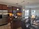 Kitchen view highlights stainless steel appliances and dark wood kitchen island with barstool seating at 905 Roxburgh Ave, Rock Hill, SC 29732