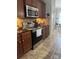 Beautiful kitchen offers stainless steel appliances, tile backsplash and dark wood cabinetry at 905 Roxburgh Ave, Rock Hill, SC 29732