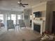 Comfortable living room with fireplace, ceiling fan, and access to outdoor patio at 905 Roxburgh Ave, Rock Hill, SC 29732
