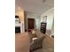Cozy living room with fireplace, dark wood accent cabinet, and an inviting upholstered couch at 905 Roxburgh Ave, Rock Hill, SC 29732