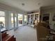 Bright sun room with French doors leading to a patio and a built-in bookcase at 905 Roxburgh Ave, Rock Hill, SC 29732