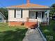 Attractive home featuring classic siding and black shutters at 915 Spruce St, Albemarle, NC 28001