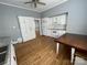 Well-lit kitchen with hardwood floors, white cabinets, and modern appliances at 915 Spruce St, Albemarle, NC 28001