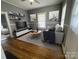 Comfortable living room featuring hardwood floors, neutral colors, and modern decor accents at 915 Spruce St, Albemarle, NC 28001