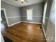 Bright living room with beautiful hardwood floors, fresh neutral paint, and natural light at 915 Spruce St, Albemarle, NC 28001