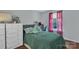 Bedroom features a dresser, a comfortable bed, and a window that lets in light at 1017 Chalk Hill Ln, Charlotte, NC 28214