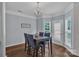Cozy dining room with a modern chandelier and view of the backyard at 1017 Chalk Hill Ln, Charlotte, NC 28214