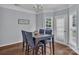 Dining area with wood floors, natural light, and a stylish chandelier at 1017 Chalk Hill Ln, Charlotte, NC 28214