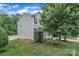 Charming two-story home with vinyl siding and well-manicured lawn and landscaping at 1017 Chalk Hill Ln, Charlotte, NC 28214