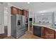Bright open kitchen with stainless appliances, granite countertops, and connection to dining area and living room at 1017 Chalk Hill Ln, Charlotte, NC 28214