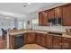 Spacious kitchen featuring granite countertops, stainless microwave and breakfast bar at 1017 Chalk Hill Ln, Charlotte, NC 28214