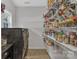 Well stocked and organized laundry room/pantry with washer, dryer and window at 1017 Chalk Hill Ln, Charlotte, NC 28214