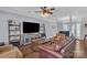 Comfortable living room featuring wood floors, a ceiling fan and an open layout at 1017 Chalk Hill Ln, Charlotte, NC 28214