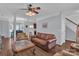 Open concept living area with wood floors, decorative columns, and adjacent dining space at 1017 Chalk Hill Ln, Charlotte, NC 28214