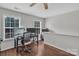 Well-lit home office with hardwood floors, a desk setup with dual monitors, and ample natural light at 1017 Chalk Hill Ln, Charlotte, NC 28214