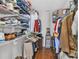 Walk-in closet with wire shelving, hanging clothes, and hardwood floors, offering plenty of storage space at 1017 Chalk Hill Ln, Charlotte, NC 28214