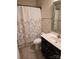 Clean bathroom with a shower-tub, vanity, and a decorative mirror providing a functional space at 1112 Avalon Pl, Stallings, NC 28104