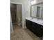 Spacious bathroom with dual sink vanity and standing shower at 1112 Avalon Pl, Stallings, NC 28104