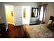 Bedroom with dark wood flooring and access to a bathroom and closet at 1112 Avalon Pl, Stallings, NC 28104