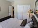 Relaxing bedroom showcases a comfortable bed, closet space, and soft lighting for a peaceful retreat at 1112 Avalon Pl, Stallings, NC 28104