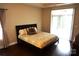 Bright bedroom with a sliding glass door and dark wood flooring at 1112 Avalon Pl, Stallings, NC 28104