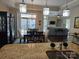 Open-concept dining area flows into the living room and features a chandelier and sliding glass doors to the patio at 1112 Avalon Pl, Stallings, NC 28104