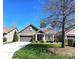 Charming home featuring stone accents, well-maintained landscaping, a driveway, and an attached two-car garage at 1112 Avalon Pl, Stallings, NC 28104