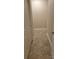 Neutral-toned hallway features tile flooring, base molding, and recessed lighting, guiding to various rooms at 1112 Avalon Pl, Stallings, NC 28104