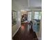 Welcoming living room featuring hardwood floors, bright windows, and a comfortable sofa, perfect for relaxation and entertaining at 1112 Avalon Pl, Stallings, NC 28104