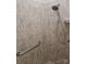 Close-up of shower stall with updated shower head and grab bar at 1112 Avalon Pl, Stallings, NC 28104
