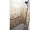 Detail shot of the tiled walk-in shower with a grab bar at 1112 Avalon Pl, Stallings, NC 28104