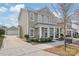 Charming two-story home with a detached garage and a cozy front porch at 11122 Aprilia Ln, Cornelius, NC 28031