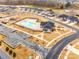 An aerial view of a sparkling pool and amenities nestled within a vibrant community at 11810 Red Leaf Dr, Charlotte, NC 28215