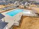 Aerial view of a resort-style community pool and adjacent playground at 11810 Red Leaf Dr, Charlotte, NC 28215