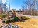 A stone sign welcomes you to Larkhaven Hills, enhanced with manicured landscaping at 11810 Red Leaf Dr, Charlotte, NC 28215