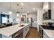 Bright kitchen with center island, stainless steel appliances, and sleek countertops at 11810 Red Leaf Dr, Charlotte, NC 28215