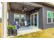 Covered patio area with outdoor seating and ceiling fan at 11810 Red Leaf Dr, Charlotte, NC 28215