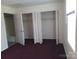 Carpeted bedroom featuring bright natural light and roomy closet space at 120 24Th Street St, Hickory, NC 28601