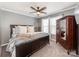 Bedroom featuring a ceiling fan, neutral colors, and natural light at 12510 Pine Terrace Ct, Charlotte, NC 28273