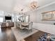 Elegant dining room featuring stylish lighting and a seamless transition to the living room at 12510 Pine Terrace Ct, Charlotte, NC 28273