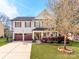 Charming two-story home featuring a well-manicured lawn and inviting curb appeal at 12510 Pine Terrace Ct, Charlotte, NC 28273