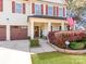 Charming front porch featuring a beautiful flower garden and traditional design at 12510 Pine Terrace Ct, Charlotte, NC 28273