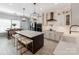 Modern kitchen with a large island, marble countertops, and stainless steel appliances at 12510 Pine Terrace Ct, Charlotte, NC 28273